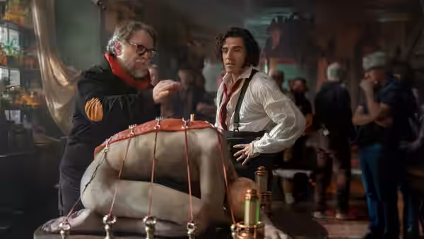 Harlander (Christoph Waltz) and Victor examining the Creature on a table