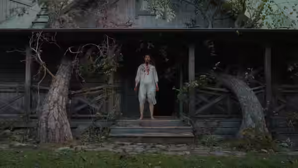 A bloodied woman in a white nightdress stands on the steps of a weathered house
