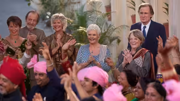 Older guests applaud as dancers perform before them