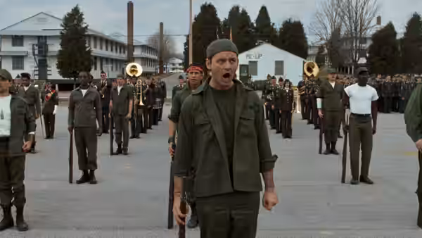John Winger (Bill Murray) shouts in front of soldiers assembled on a parade ground