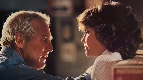 Michael Colin Gallagher (Paul Newman) speaks closely with Megan Carter (Sally Field)