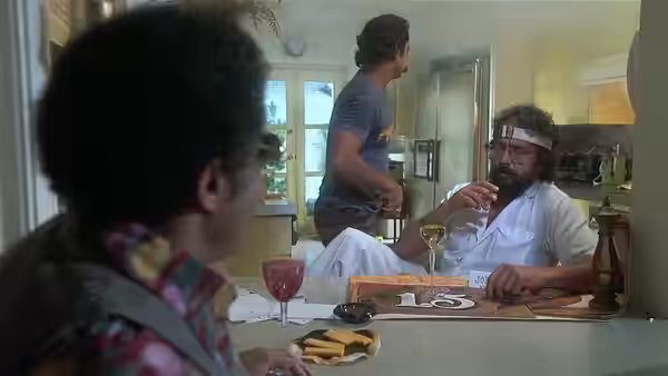 Chong (Tommy Chong) sits at a kitchen table with two men