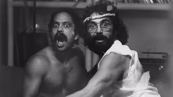 Cheech (Cheech Marin) and Chong (Tommy Chong) stare wide-eyed together indoors