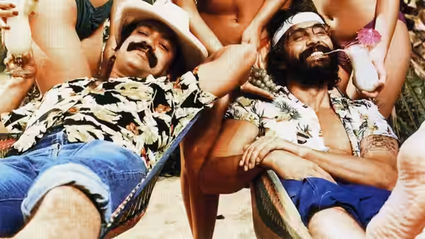 Cheech (Cheech Marin) and Chong (Tommy Chong) recline in deck chairs among women
