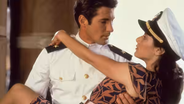Zack Mayo (Richard Gere) holds Paula Pokrifki (Debra Winger) in his Navy uniform