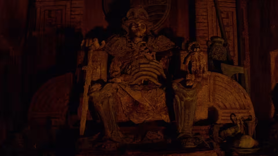 A massive armored figure sits on a throne in a shadowy hall