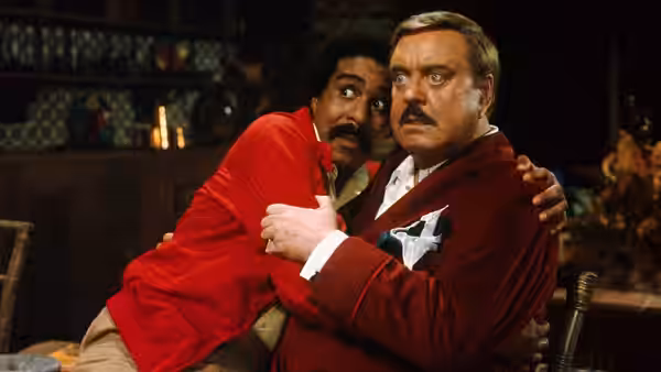 Jack Brown (Richard Pryor) clings to U.S. Bates (Jackie Gleason) in alarm