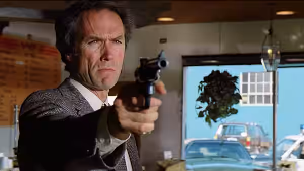Harry Callahan (Clint Eastwood) aims his revolver inside a room
