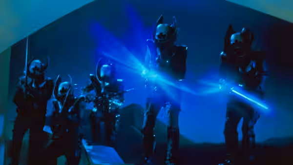 Armored, horn-helmeted warriors advance through a blue-lit passage with glowing weapons
