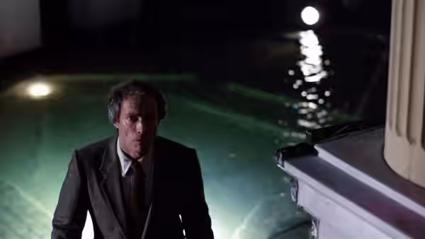 Wes Block (Clint Eastwood) climbs from a swimming pool at night