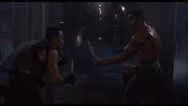 John Matrix (Arnold Schwarzenegger) faces a knife-wielding man in a dim industrial room