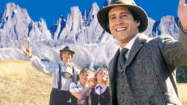 Clark (Chevy Chase), Ellen (Beverly D'Angelo), Audrey (Dana Hill) and Rusty (Jason Lively) pose before the Dolomites