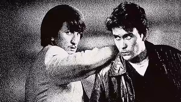 Daulton Lee (Sean Penn) reaches across Christopher Boyce’s (Timothy Hutton) shoulders