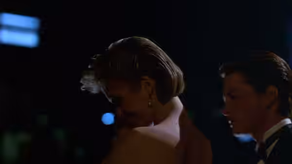 Vera Prescott and Brantley Foster stand together at night in formal dress