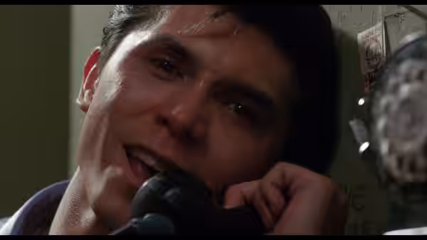 Ritchie Valens (Lou Diamond Phillips) speaks tearfully on a telephone