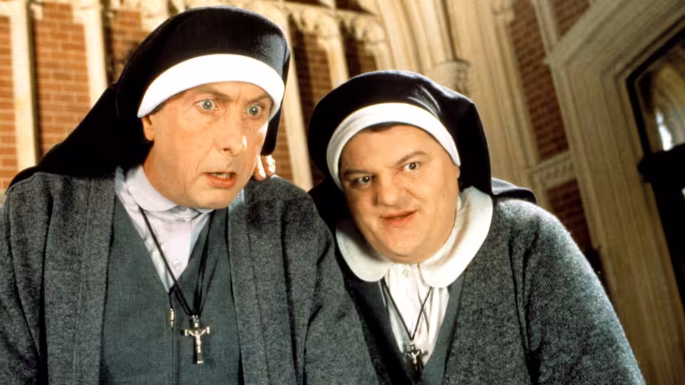 Brian Hope (Eric Idle) and Charlie McManus (Robbie Coltrane) disguised as nuns on a street