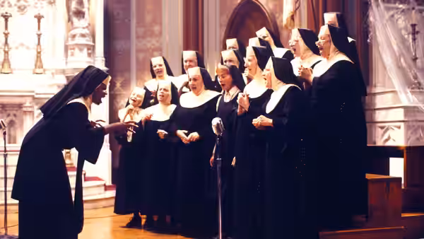 Sister Mary Clarence (Whoopi Goldberg) conducts the convent choir in the church