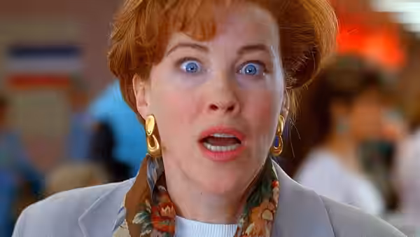 Kate (Catherine O'Hara) reacts with alarm inside an airport