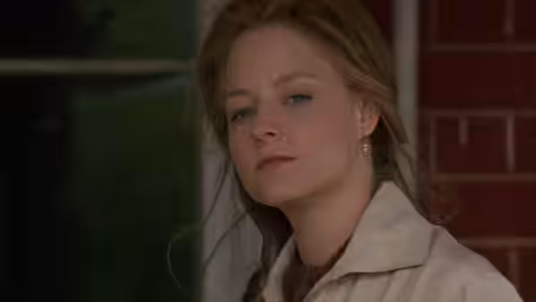 Laurel Sommersby (Jodie Foster) looks ahead from beside a window