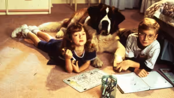 Emily and Ted lie beside Beethoven with open books on the floor