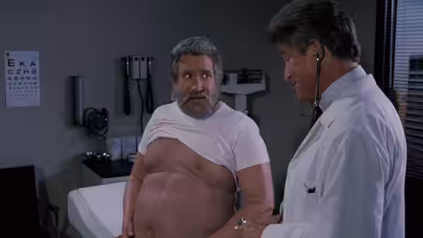 Scott Calvin (Tim Allen) stands in an examination room while a doctor examines him