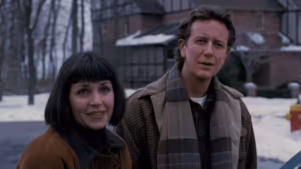 Laura (Wendy Crewson) and Neal (Judge Reinhold) stand outside in the snow