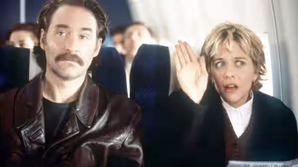 Luc Teyssier (Kevin Kline) and Kate (Meg Ryan) sit beside each other on a plane