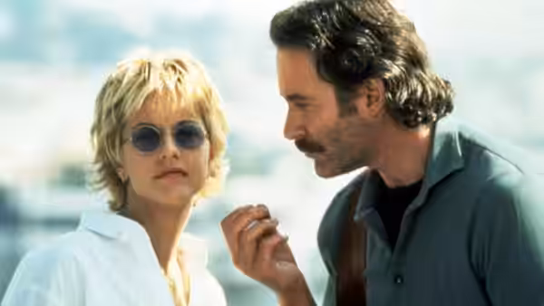 Kate (Meg Ryan) wears sunglasses as Luc Teyssier (Kevin Kline) speaks beside her