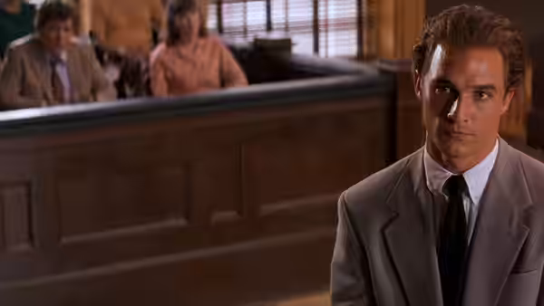 Jake Brigance (Matthew McConaughey) sits in the courtroom before the jury box