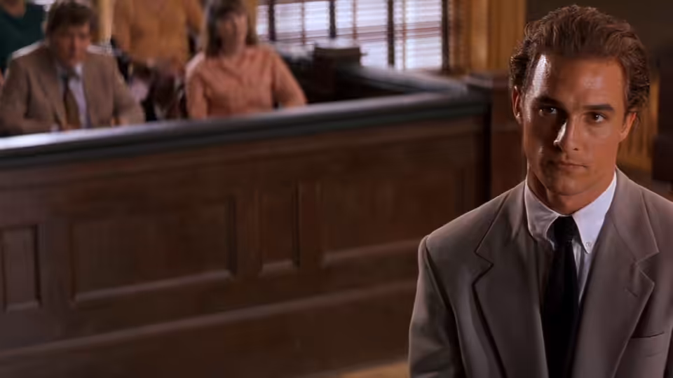Jake Brigance (Matthew McConaughey) sits in the courtroom before the jury box
