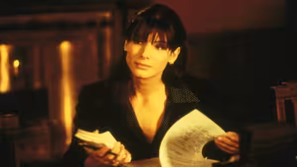 Ellen Roark (Sandra Bullock) reviews papers inside the courtroom