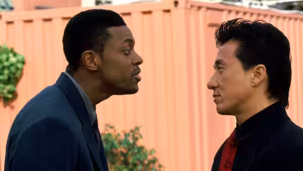 Carter (Chris Tucker) and Lee (Jackie Chan) face each other outside a shipping container