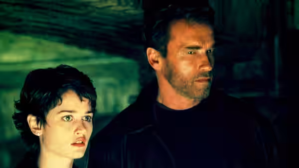 Christine York (Robin Tunney) and Jericho Cane (Arnold Schwarzenegger) look toward danger