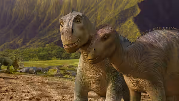 Aladar (D. B. Sweeney) and Neera (Julianna Margulies) stand together in a mountain valley