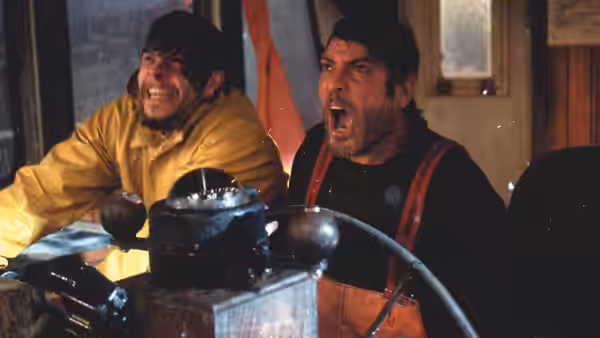 Bobby Shatford (Mark Wahlberg) and a crewmate brace at the fishing boat's wheel