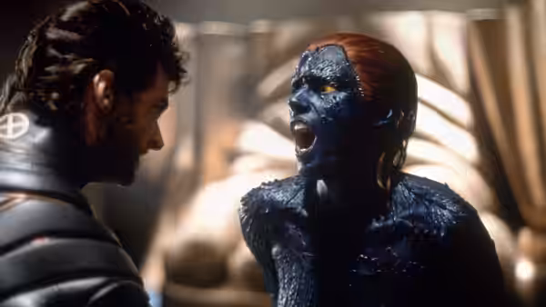 Logan faces blue-skinned Mystique (Rebecca Romijn) as she yells inside the X-Mansion