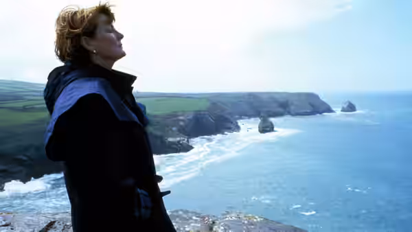 Grace Trevethyn (Brenda Blethyn) looks out over the sea from a coastal cliff