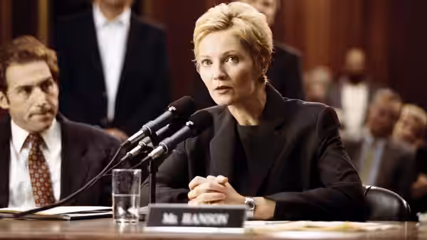 Laine Hanson (Joan Allen) sits before microphones at a Senate confirmation hearing