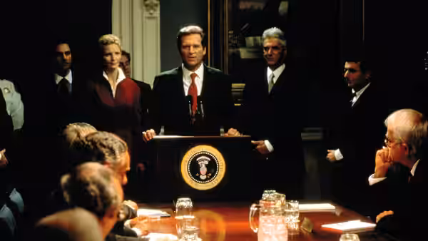 President Jackson Evans (Jeff Bridges) addresses officials gathered around a White House conference table