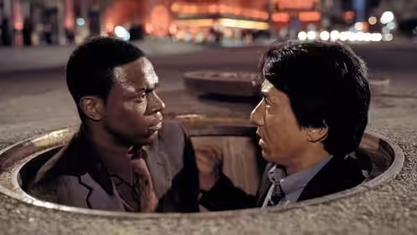 Carter and Lee talk from inside a manhole at night