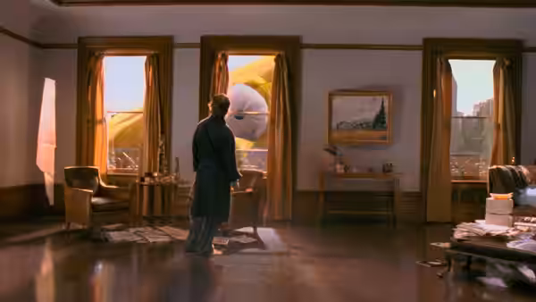 David Aames (Tom Cruise) stands in a disordered apartment, facing bright windows overlooking the city