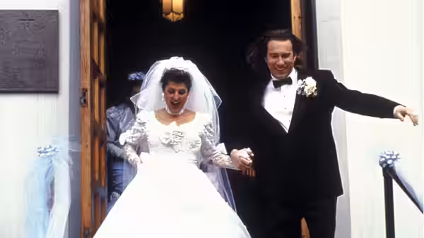 Toula Portokalos (Nia Vardalos) and Ian Miller (John Corbett) emerge from the church as newlyweds
