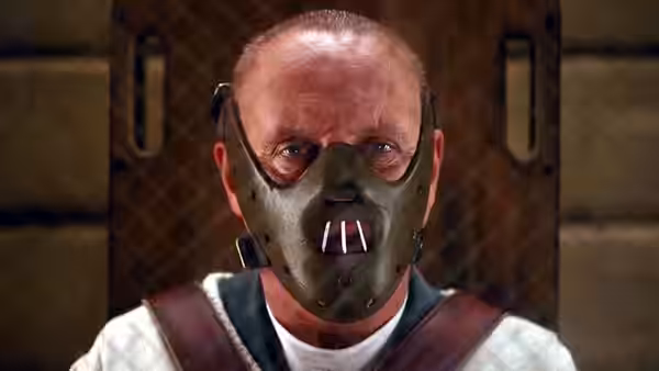 Hannibal Lecter (Anthony Hopkins) wears a muzzle and restraint harness