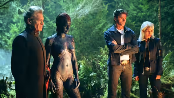 Magneto (Ian McKellen), Mystique (Rebecca Romijn), Wolverine (Hugh Jackman), and Storm (Halle Berry) stand among trees