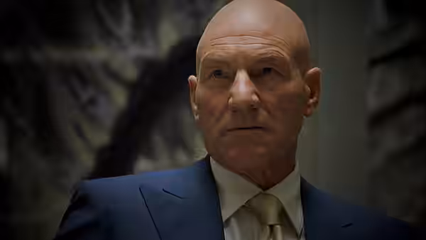 Professor Xavier (Patrick Stewart) looks ahead in a suit and tie