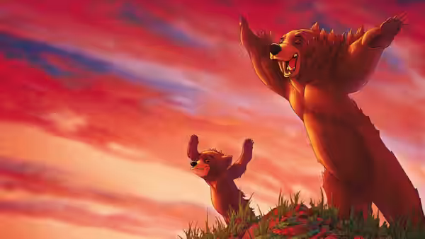 Kenai (Joaquin Phoenix) and Koda (Jeremy Suarez) raise their paws on a grassy ridge