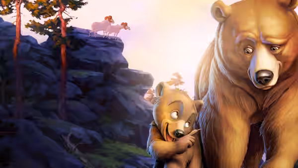 Kenai (Joaquin Phoenix) and Koda (Jeremy Suarez) pass below rams standing on a cliff