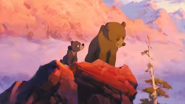 Kenai (Joaquin Phoenix) and Koda (Jeremy Suarez) look out from a rocky mountain peak