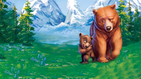 Kenai (Joaquin Phoenix) walks beside Koda (Jeremy Suarez) through a mountain meadow