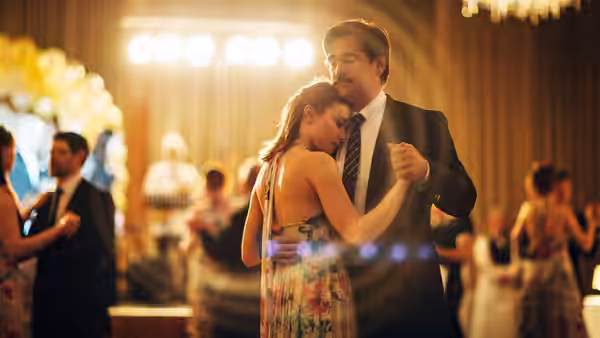 couple slow dancing together on a formal event dance floor